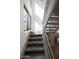 Modern staircase with metal railings and stone tile at 320 W Cypress St, Phoenix, AZ 85003