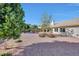 Large backyard with gravel, desert landscaping, and a seating area at 3439 E Topeka Dr, Phoenix, AZ 85050