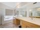 Double vanity bathroom with soaking tub and shower at 3439 E Topeka Dr, Phoenix, AZ 85050