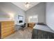 Guest bedroom with workspace and built-in dresser at 3439 E Topeka Dr, Phoenix, AZ 85050