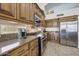 Well-equipped kitchen, ample cabinetry, granite counters at 3439 E Topeka Dr, Phoenix, AZ 85050