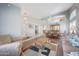 Living room with hardwood floors and access to the kitchen and dining area at 3439 E Topeka Dr, Phoenix, AZ 85050