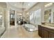 Luxurious bathroom features a soaking tub, dual vanities, and custom tile work at 350 W Yellowstone Way, Chandler, AZ 85248