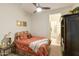 Cozy bedroom with carpet, ceiling fan, neutral paint, and adjoining bathroom access at 350 W Yellowstone Way, Chandler, AZ 85248