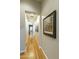 Bright hallway with hardwood flooring and artwork on the walls at 350 W Yellowstone Way, Chandler, AZ 85248