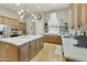 Spacious kitchen with stainless steel appliances, island, and custom cabinetry at 350 W Yellowstone Way, Chandler, AZ 85248