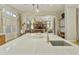 Gourmet kitchen island boasts white marble countertop, sink with a brass faucet, and an open layout at 350 W Yellowstone Way, Chandler, AZ 85248