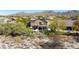 Aerial view of a home with a private backyard oasis, lush landscaping, and sparkling pool at 3652 N Sonoran Hts, Mesa, AZ 85207