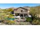 Scenic backyard featuring a swimming pool, covered seating, outdoor fire pit, and lush greenery at 3652 N Sonoran Hts, Mesa, AZ 85207