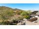 Scenic backyard view from the balcony, showcasing the desert landscape and outdoor fire pit seating at 3652 N Sonoran Hts, Mesa, AZ 85207