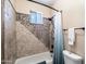 Modern bathroom featuring custom tiling, a shower head, and a window for ventilation at 3652 N Sonoran Hts, Mesa, AZ 85207