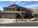 Two-story house with three-car garage and desert landscaping at 3652 N Sonoran Hts, Mesa, AZ 85207