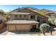 Inviting two-story home featuring a three-car garage and well-maintained landscaping at 3652 N Sonoran Hts, Mesa, AZ 85207