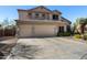 Beautiful home with a three-car garage, stone accents, and a wide driveway at 3652 N Sonoran Hts, Mesa, AZ 85207