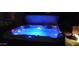 Illuminated hot tub with water features, providing a relaxing and luxurious outdoor experience at 3652 N Sonoran Hts, Mesa, AZ 85207