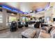 Spacious living room with a home theater, natural lighting, and access to the backyard at 3652 N Sonoran Hts, Mesa, AZ 85207