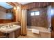 Clean bathroom with bathtub and shower at 36601 N Mule Train Rd # B40, Carefree, AZ 85377