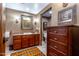 Bathroom with granite vanity and large mirror at 36601 N Mule Train Rd # B40, Carefree, AZ 85377