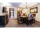 Elegant dining room with a chandelier and stylish table setting at 36601 N Mule Train Rd # B40, Carefree, AZ 85377