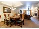 Rustic dining room with unique cowhide chairs and chandelier at 36601 N Mule Train Rd # B40, Carefree, AZ 85377