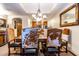 Dining area with a large table and cowhide chairs at 36601 N Mule Train Rd # B40, Carefree, AZ 85377