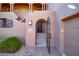 Private entry with wrought-iron gate and brick pavers at 36601 N Mule Train Rd # B40, Carefree, AZ 85377