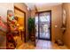 Open entry with tile floors and unique decor at 36601 N Mule Train Rd # B40, Carefree, AZ 85377