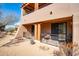 Building exterior with private patios and desert landscaping at 36601 N Mule Train Rd # B40, Carefree, AZ 85377