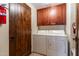 Laundry room with washer, dryer, and cabinets at 36601 N Mule Train Rd # B40, Carefree, AZ 85377