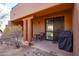 Covered patio with seating area and grill, perfect for outdoor entertaining at 36601 N Mule Train Rd # B40, Carefree, AZ 85377