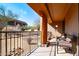 Private patio with wrought iron railings and desert views at 36601 N Mule Train Rd # B40, Carefree, AZ 85377