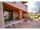 Private patio with seating area and desert landscaping at 36601 N Mule Train Rd # B40, Carefree, AZ 85377