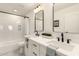 Modern bathroom with double vanity, soaking tub and matte black fixtures at 3743 W Shannon St, Chandler, AZ 85226