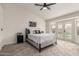 Main bedroom with backyard access and ceiling fan at 3743 W Shannon St, Chandler, AZ 85226