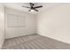 Bright bedroom with ceiling fan and neutral carpeting at 3743 W Shannon St, Chandler, AZ 85226