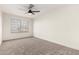 Simple bedroom with ceiling fan and carpeted floor at 3743 W Shannon St, Chandler, AZ 85226