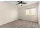 Spacious bedroom with ceiling fan and window at 3743 W Shannon St, Chandler, AZ 85226