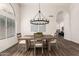 Bright dining room with a large wooden table and chandelier at 3743 W Shannon St, Chandler, AZ 85226