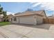 View of the house's side, highlighting the garage and wooden gate at 3743 W Shannon St, Chandler, AZ 85226