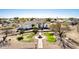 Wide aerial view of a ranch-style home featuring well-manicured landscaping, a fountain, and mature trees at 3791 E Vista Grande Dr, San Tan Valley, AZ 85140