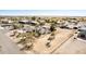 Aerial view of a sprawling ranch-style home with horse property in an open desert landscape at 3791 E Vista Grande Dr, San Tan Valley, AZ 85140