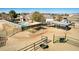 Aerial view of an equestrian property featuring a pool, horse facilities and desert landscaping at 3791 E Vista Grande Dr, San Tan Valley, AZ 85140