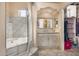 Bathroom featuring a shower, a bathtub, a vanity with storage and a view into a walk-in closet at 3791 E Vista Grande Dr, San Tan Valley, AZ 85140