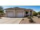 Charming single-story home featuring a three car garage, large driveway and desert landscaping at 3791 E Vista Grande Dr, San Tan Valley, AZ 85140