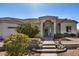 Close-up of a home's front entrance featuring desert landscaping and an elegant entryway at 3791 E Vista Grande Dr, San Tan Valley, AZ 85140