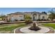 Beautiful single-story home featuring a well-manicured lawn, a water fountain, and a three-car garage at 3791 E Vista Grande Dr, San Tan Valley, AZ 85140