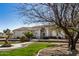 A well-maintained home featuring mature trees, green grass, and desert landscaping at 3791 E Vista Grande Dr, San Tan Valley, AZ 85140