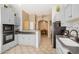 Kitchen with grey cabinets, tile backsplash and breakfast bar at 3791 E Vista Grande Dr, San Tan Valley, AZ 85140