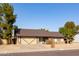 Ranch-style house with a two-car garage and well-maintained front yard at 3910 W Michigan Ave, Glendale, AZ 85308