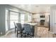 Modern kitchen with a breakfast bar, stainless steel appliances, and granite countertops at 3910 W Michigan Ave, Glendale, AZ 85308